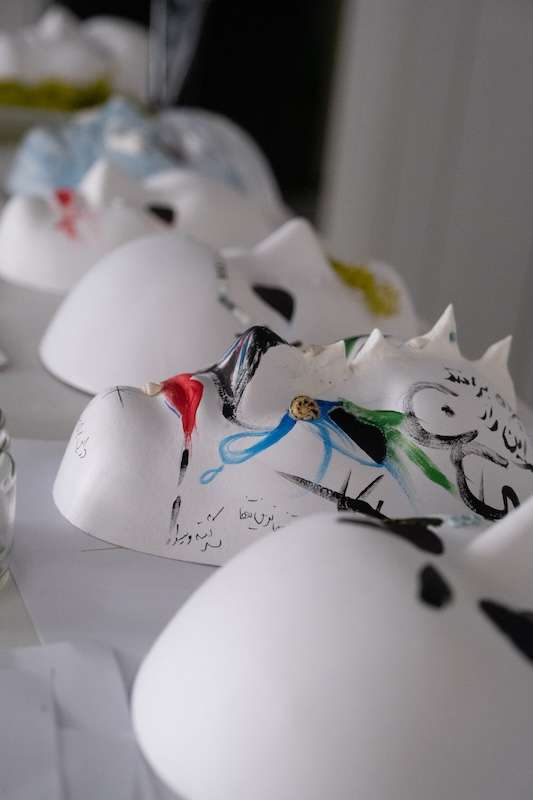 Close up of some masks with colourful spots. 